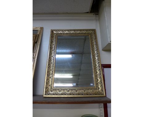 A gilt framed mirror