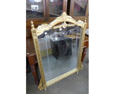 A reproduction French Louis XV style gilt mirror