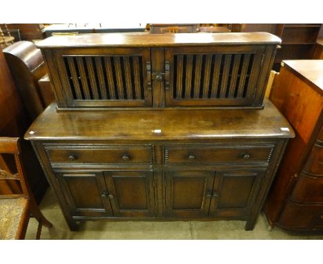 an Ercol court cupboard