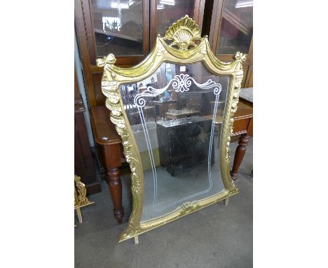 A reproduction French Louis XV style gilt mirror