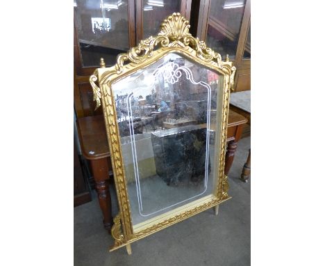 A reproduction French Louis XV style gilt mirror