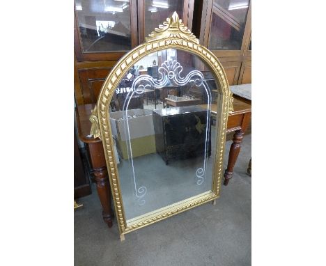A reproduction French Louis XV style gilt mirror