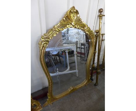 A reproduction French Louis XV style gilt mirror