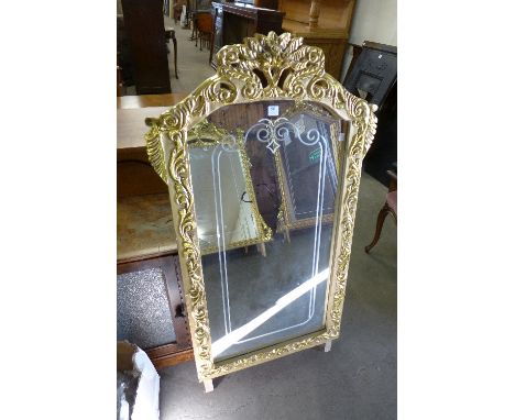 A reproduction French Louis XV style gilt mirror