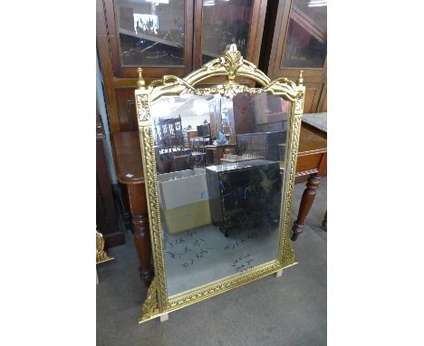 A reproduction French Louis XV style gilt mirror