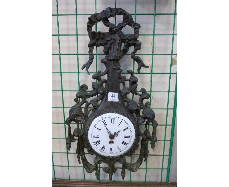 A 19th Century rococo revival cast bronze wall clock with white enamelled dial