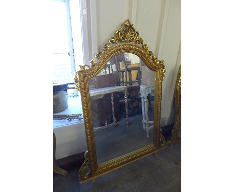 A reproduction French Louis XV style gilt mirror