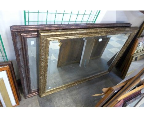 A gilt mirror and walnut effect mirror