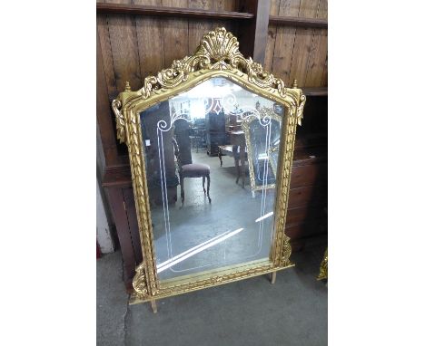 A reproduction French Louis XV style gilt mirror