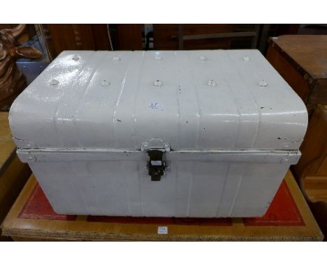 A white painted tin trunk