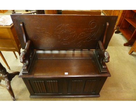 A carved oak monk's bench