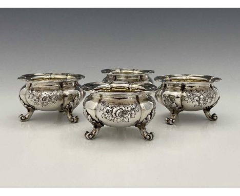 Paul Storr.A set of four William IV or early Victorian salt cellars, each of panelled oval form, the body decorated with swag