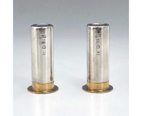 A pair of cased Elizabeth II silver novelty condiments, modelled in the shape of shotgun cartridges, one with single central 