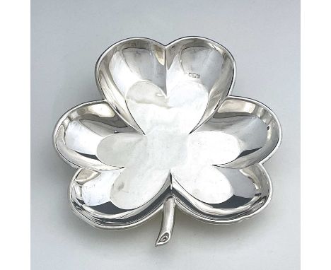 An Edwardian silver novelty serving dish, modelled in the form of a leaf with hexafoil body and stem form handle, R Hodd &amp