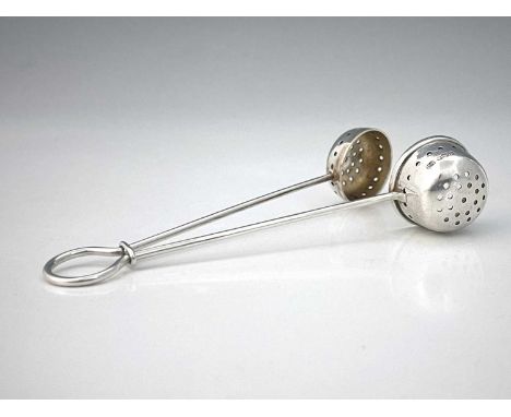 A George VI silver tea infuser, of bow form, with dual pierced scoop form ends, secured together by an integral loop, Henry A