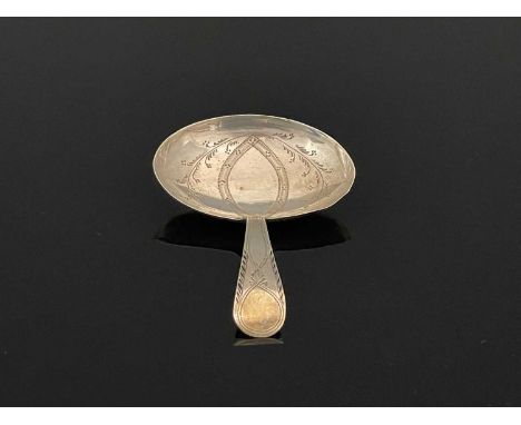 A George III silver tea caddy spoon, with oval shaped bowl, decorated with foliage and with a feather edge, Joseph Taylor, Bi