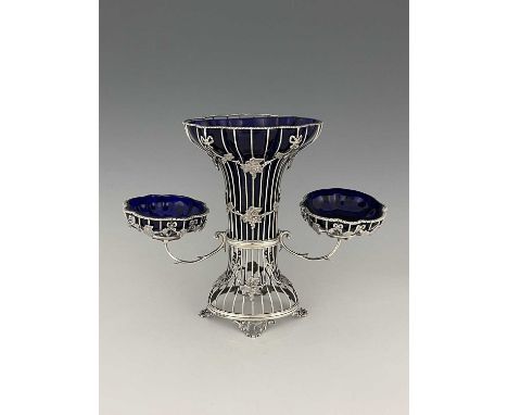 An Edwardian silver epergne, modelled in the style of the second half of the eighteenth century, the wirework body decorated 