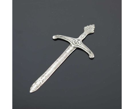 Iona.A George V silver letter opener, modelled in the form of a Scottish claymore sword, decorated with a Celtic knot, the ob
