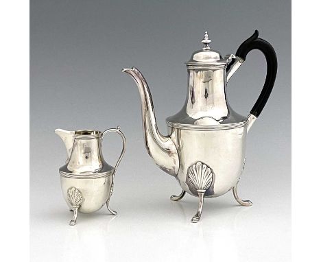 A late Victorian silver coffee pot and cream jug, each of ogee form, atop three hoof feet with anthemion terminals, the coffe