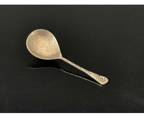 A twentieth-century Arts &amp; Crafts silver caddy spoon, with planished bowl, the stem with Celtic inspired decoration, the 