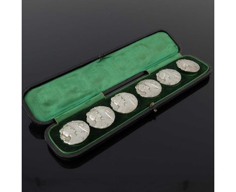  A set of six Edwardian silver Art Nouveau buttons, each pressed and decorated with the bust of a nymph holding and surrounde