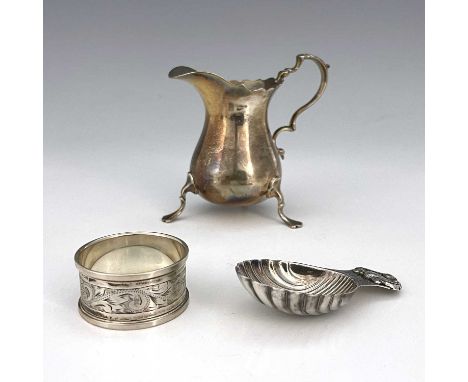 Three twentieth-century hallmarked silver items, to include a milk or cream jug, modelled in the eighteenth-century style, wi