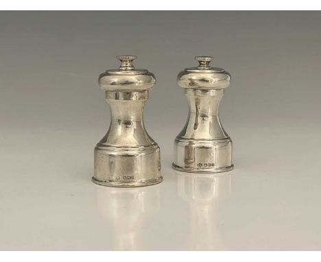 A pair of Elizabeth II silver-mounted pepper grinders, of baluster form, the internal mechanism marked 'PEUGEOT FRERES', the 