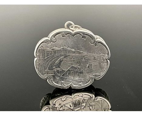 A Victorian silver castle top vinaigrette, of lobed oval form, the cover with engraved scene of Brightonhelmstone (Brighton),