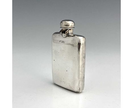 An early twentieth-century silver hip flask, of rounded rectangular form, the hinged cover secured with a bayonet fitting, Wi