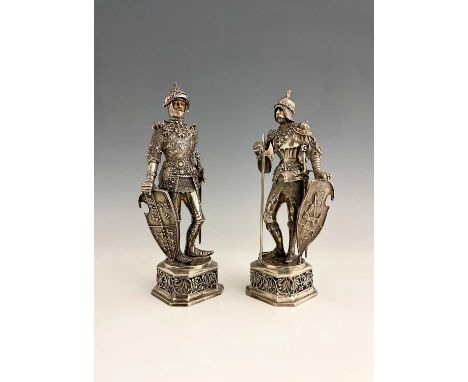 A pair of late nineteenth or early twentieth-century German silver figures of medieval armoured knights, one standing holding