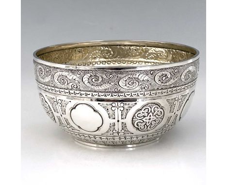 A Victorian silver Aesthetic style bowl, of globular form with rounded base, the exterior decorated with foliate scrolls, and