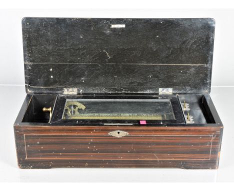 A late 19th century musical box, playing eight hymns and oratorio airs, with tune indicator, in grained case with inlaid lid 