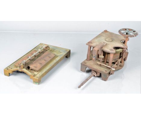 Polyphon parts, a motor for an upright Polyphon, the spring dated 97; and a 15 ¾ -in. bedplate with two combs (two bass teeth