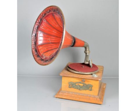 A horn gramophone,  with Lindstroem-type motor and pressed-steel horn with original shaded red paint (back of case split, no 