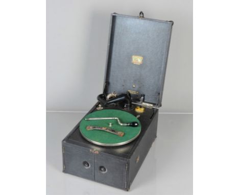 A portable gramophone, HMV Model 105, with Exhibition soundbox on black gooseneck tone-arm and hinged motor board, internal h