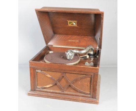 A table grand gramophone, HMV Model 104, with 5A sound box, in oak case (spring defective, slight veneer damage to fret and l