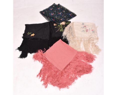 Five early 20th century 1920s and 1930s Art Deco vintage shawls. The lot comprising two black silk with hand embroidered with