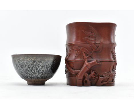 A 20th century Chinese zisha brush holder pot and a Song style oil spot jian-ware tea bowl. The lot comprising a bamboo shape