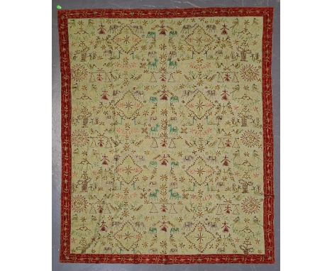 A large bed / couch tapestry throw. The throw having an olive green background colour, decorated with floral pattern red bord