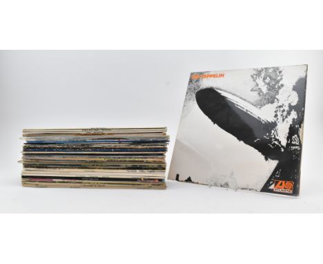 A mixed selection of long play LP vinyl record albums to include The Rolling Stones, Kraftwerk Autobahn, Alice Cooper Welcome