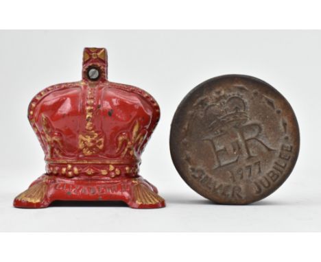 Royal interest - A 1953 Queen Elizabeth II Coronation cast iron money box. The money box moulded in form of a crown painted r
