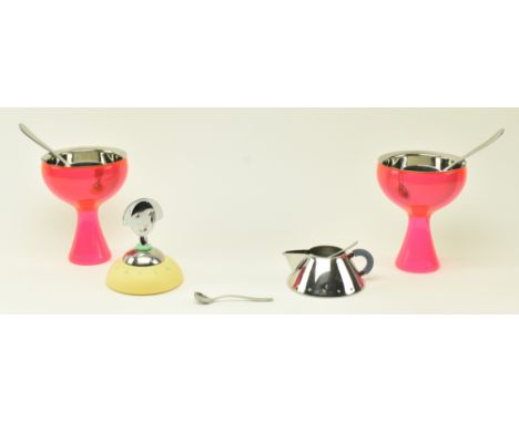 Alessi - a collection of contemporary Italian designer kitchenware. The lot comprising two stainless steel &amp; neon pink tw