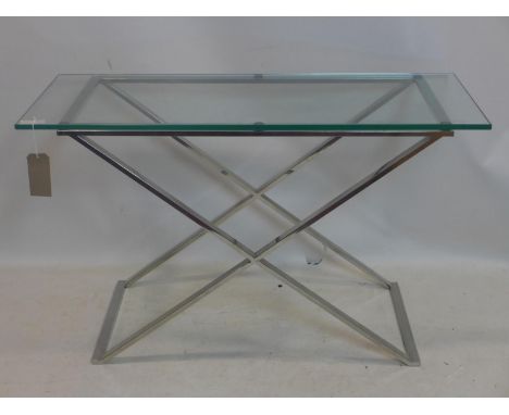 A contemporary console table with glass top raised on chrome X frame base, H.76 W.122 D.46cm 