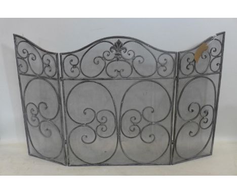 A fireguard with scrolling ironwork, 82 x 111cm (full extended) 