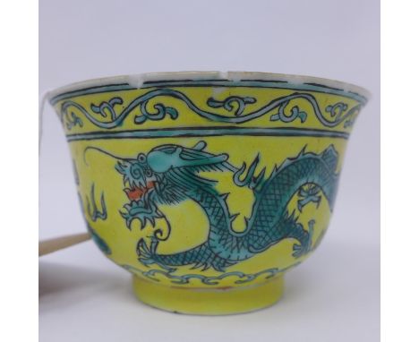 A Chinese yellow and green enamelled dragon bowl, with six character marks for Guangxu and applied collectors inventory numbe