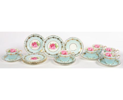 A SET OF SIX AYNSLEY LIGHT BLUE GROUND TEA CUPS, SAUCERS AND SIDE PLATES, DECORATED WITH A ROSE, PRINTED MARK 