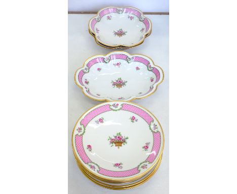 A LIMOGES DESSERT SERVICE DECORATED WITH A BASKET OF FLOWERS AND SINGLE ROSES IN PUCE SCALE BORDER, PLATE 21CM D, PRINTED MAR