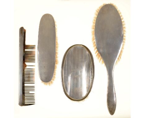 THREE GEORGE V SILVER BRUSHES AND A COMB, BIRMINGHAM 1911, 1917 AND 1918, COMB MARKS RUBBED (4) 