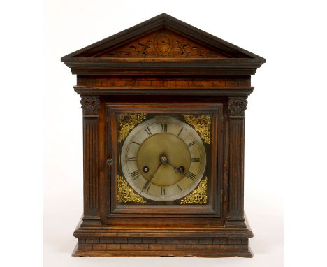 A WALNUT ARCHITECTURAL TYPE MANTEL CLOCK WITH BRASS AND SILVERED DIAL, EARLY 20TH C, 38CM H X 31CM W 
