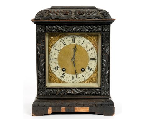 A CARVED AND DARK STAINED OAK MANTEL CLOCK WITH LENZKIRCH TING TANG MOVEMENT, 32CM H, LATE 19TH C 